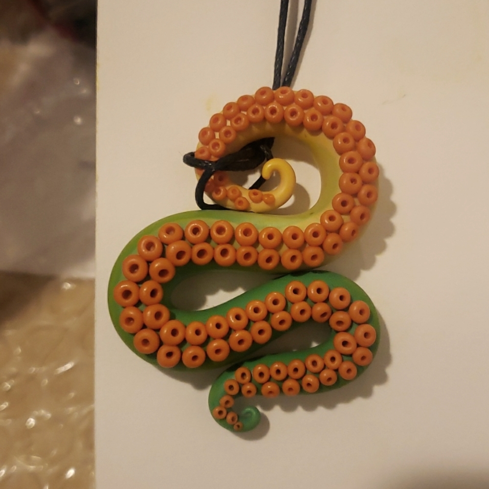 Octopus pendant.  Green and orange